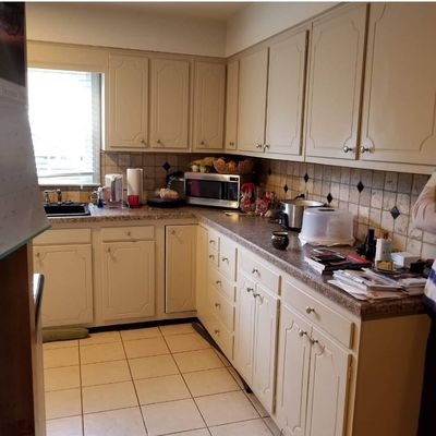 Before--an out of date kitchen and a wall that blocked the space!