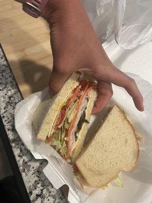 Build your own sandwich with sourdough, turkey, pepperoni, spicy mustard, lettuce, tomato, black olives, onion, and banana peppers.