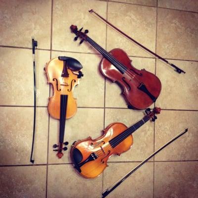 The violin triangle that symbolizes the parent teacher student relationship.