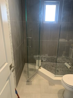 All new tile and frameless glass