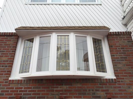 Bow window with gold diamonds.