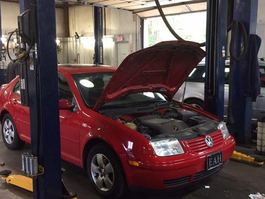 In a service bay a be beetle getting a routine service