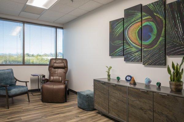 The "Vibrant Ascension" treatment room. All rooms feature a zero gravity recliner for a comfortable medicine journey.