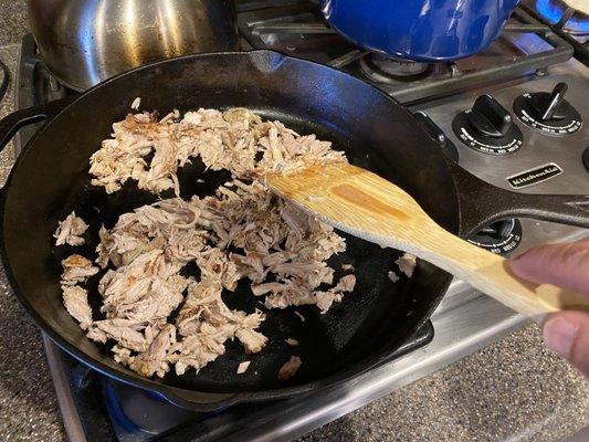 Pork carnitas getting browned