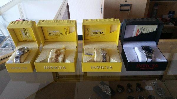 A small variety of invicta watches