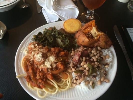 Spaghetti and meatballs, baked sweet potato, greens, black eyed peas and rice. Lord open up the gates of heaven for this cookin!