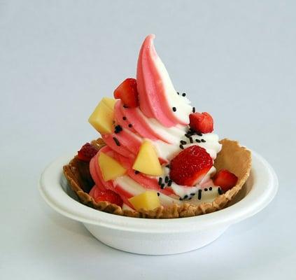 Hawaiian Delight Sorbet and Pineapple Tart yogurt topped with strawberries, mango and chocolate sprinkles in a waffle bowl