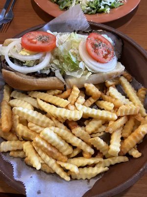 Roast beef sub with fries.