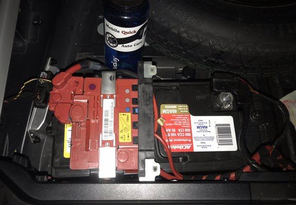 Battery replacement for 2008 BMW X5 at customer's work location.