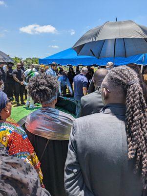 Dignity Memorial employees performing burial.