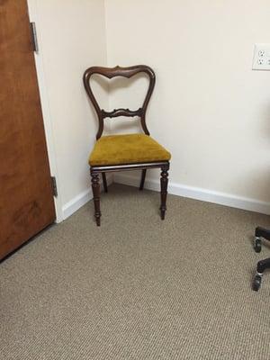 There is a magnificent chair in the exam room.