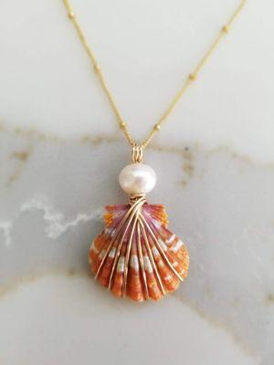 "Coral Rise"  A Champaign Pearl from the South Seas on this ultra rare top of the Hawaiian Sunrise Scallop Shell.