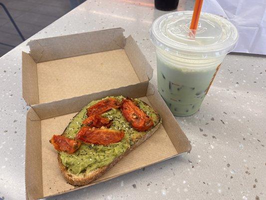 Roasted tomatoes on Avocado toast and small iced Matcha latte.