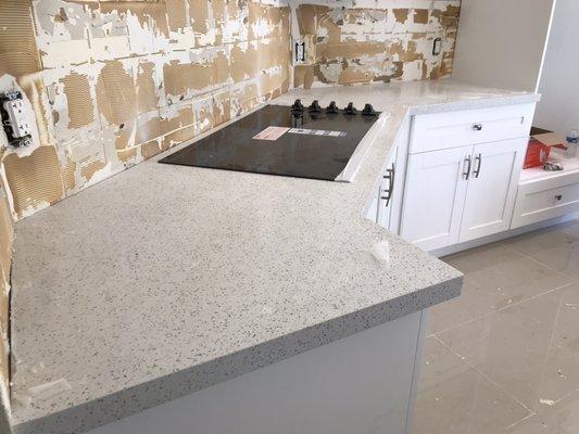 Sparkling white kitchen with angles and cooktop cutout