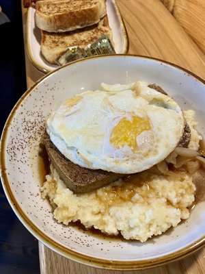 Scrapple with over easy eggs and Gouda grits. These bites literally melt in your mouth.