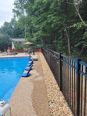 Fence and river rocks, Installed around the pool!