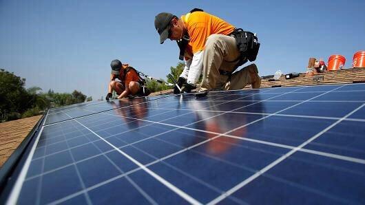 Our technicians installing the micro inverter panels