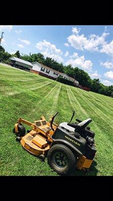 Mowing with detailed edging, weedeating and blowing.