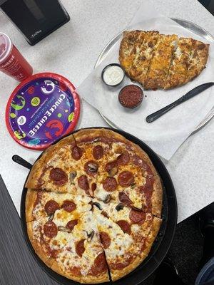 $34 for 1 pizza two toppings (mushrooms was lacking), bread sticks and 2 drinks.