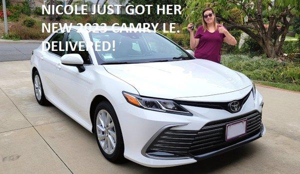 We just got Nicole a new  2023 Toyota Camry LE FWD 4-Door Sedan, in Ice Cap! Delivered to her driveway.