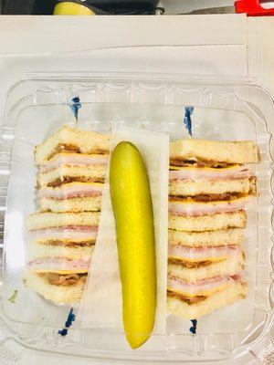 Club sandwich with side pickel..