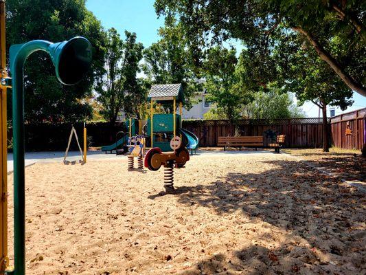 Preschool playground toys with sand under them