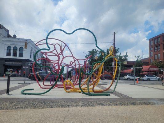 How many different foods can you find in this art outside Lexington Market?