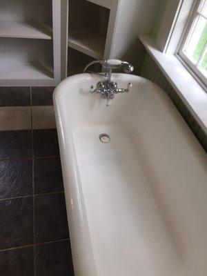 Latest project. House was abandoned. Took four days to clean. Bath tub after cleaning.