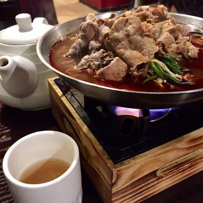 Hot pot with lamb, beef, enoki, spinach and tofu skin