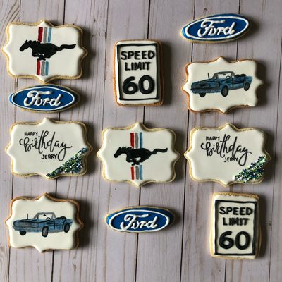 Hand decorated royal icing cookies for a Ford themed birthday