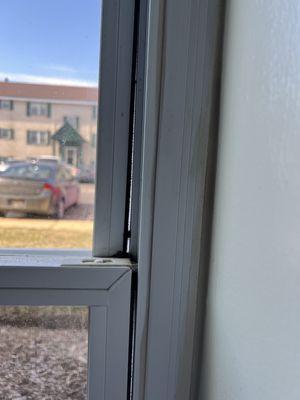 Gap in bedroom window that was reported and never fixed