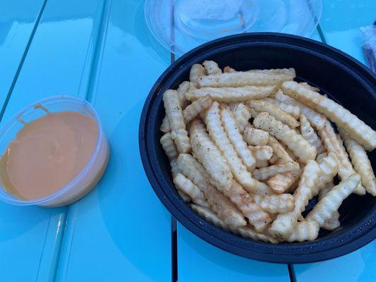 Crinkle fries with side of cheese dip