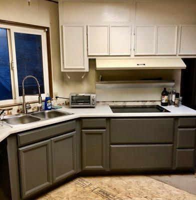 New cabinets are enhanced by new countertops.