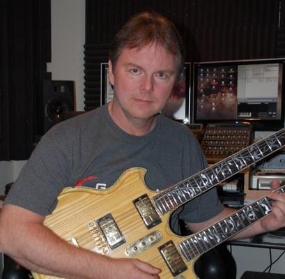 In my home studio, playing my very heavy double neck guitar.