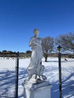 Large concrete statue on base