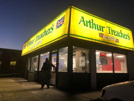 The lit up front entrance to the newly REOPENED Arthur Treachers!