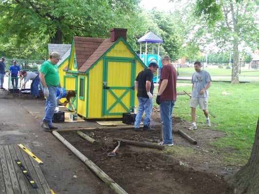 Painting playground houses, installing timber boarder between walkway and grass area.