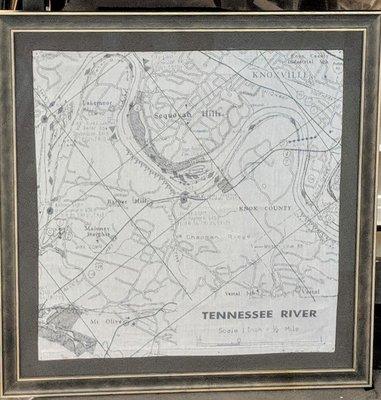 A framed placemat showing a map of the Tennessee River and surrounding areas.