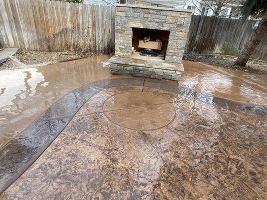 Stamped colored concrete with custom fire place