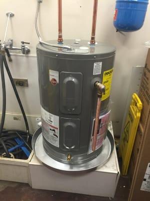 New electric water heater in a commercial building.