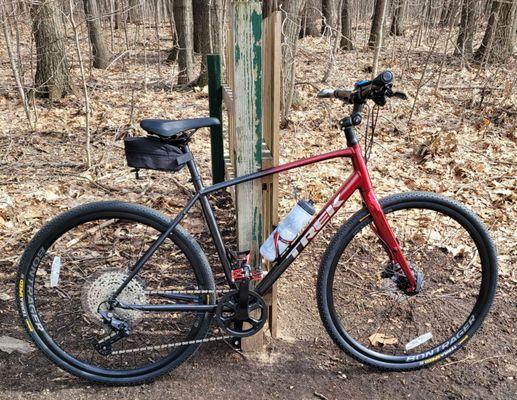 Trek fx4 leaning on a fence