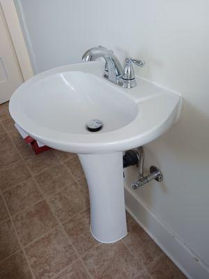 Installed new faucet and pedestal sink.