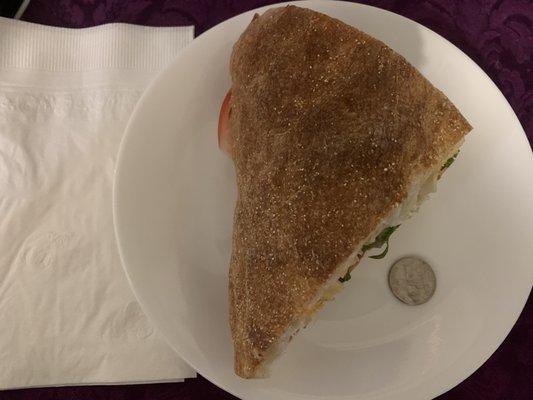 Pictured here is a quarter of the sandwich which I had for lunch; and a quarter to provide a frame of reference.