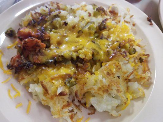 Hashbrown scramble with cheese, tomatoes, and peppers