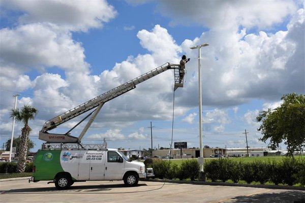 We clean everything thanks to our lift! Including parking lot lights so they can shine their brightest.