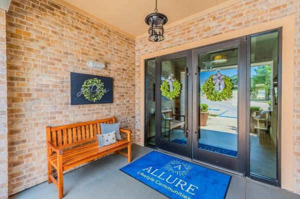 Welcome to Sunstone Village! Our Gather bench at the entry to our clubhouse is a wonderful place to sit and visit with new friends.