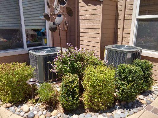 2 new air conditioners providing cold air on hot days