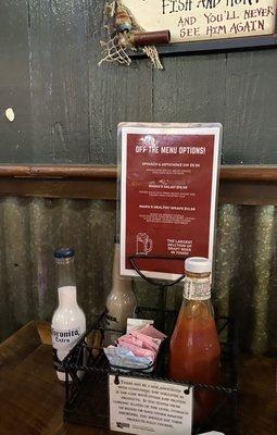 Condiments on table and extra menu options