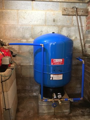 Well tank installation with brass T, pressure gauge, pressure relief valve, drain valve and whole house shut off valve. All Done with Pride!