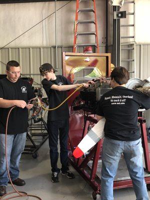 Students learn about engine repair and maintenance.